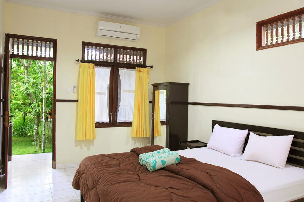 Cinthya Guest House Легиан Номер фото
